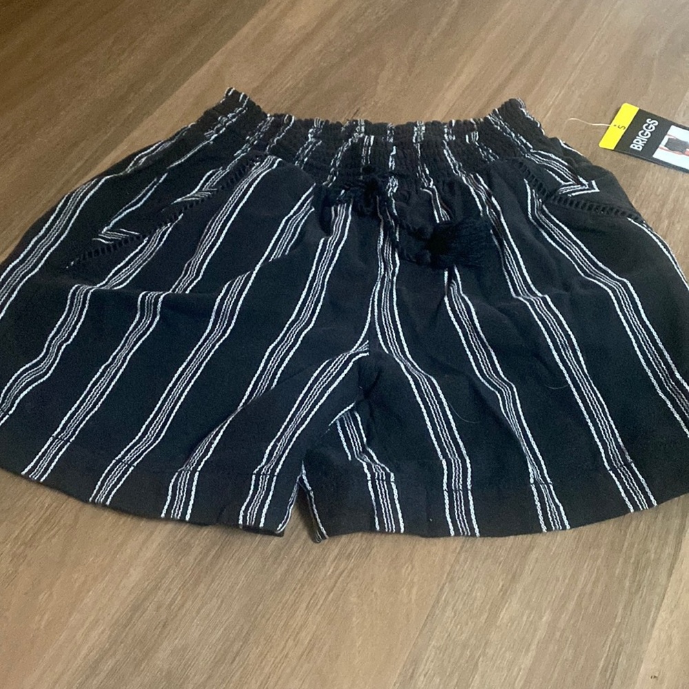 Black and white shorts.